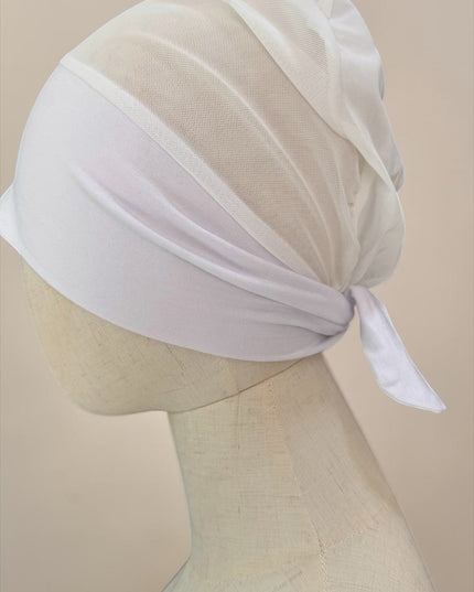 awra.at white jersey cotton bonnet with breathable mesh back and tie detail for comfortable everyday wear.